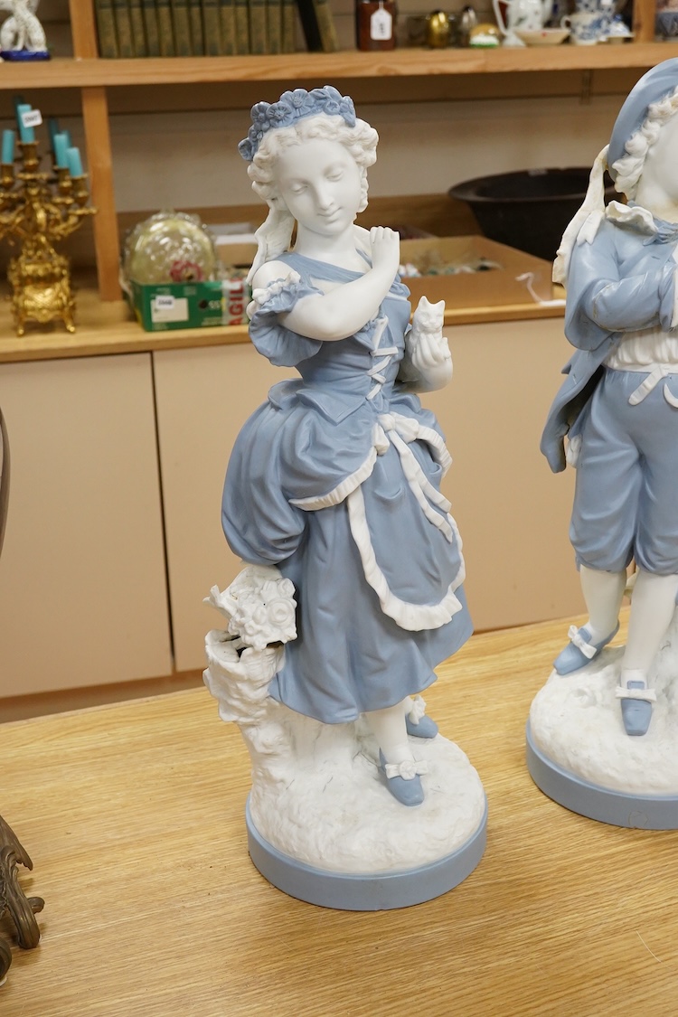 A pair of French part-bisque figures, 57cm high
